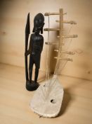 An African carved hardwood figure of a warrior with spear,