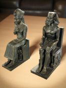 A pair of Egyptian style bronze-effect bookends on marble plinths, height 27 cm.