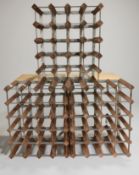Three wood and metal wine racks,