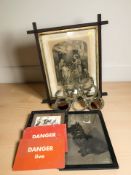 A brass bottle rack in the form of horse shoes and a group of pictures and signs,