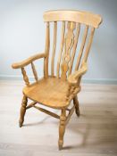 A pair of pine farmhouse style spindle backed chairs,