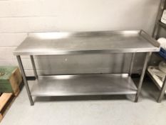 A stainless steel commercial two tier catering bench,