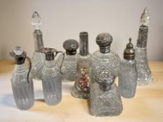 A collection of silver-topped and mounted items including condiments, jars etc,