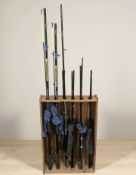 Six various fishing rods including a Fladen Powerstick 12' rod, similar 11' rod,