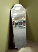 An Art Deco frameless mirror.
