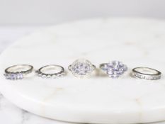 Five silver tanzanite dress rings.