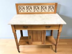 A late Victorian satinwood and marble tiled washstand,