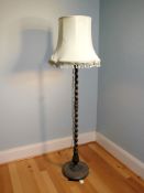 An oak barley twist standard lamp with shade