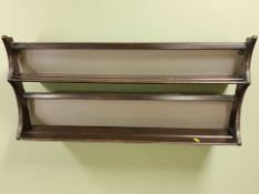 An Ercol stained elm plate rack,