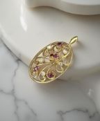 An 18ct yellow gold pendant set with diamonds and rubies CONDITION REPORT: 6g