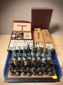 A die cast metal chess set, kings 10 cm, together with several sets of dominoes, playing cards, etc.