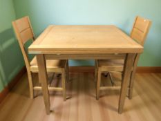 A reproduction oak pull out dining table,