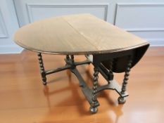 An oak drop leaf table,