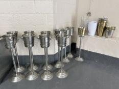A quantity of stainless steel champagne buckets, some with stands,