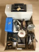 A group of metal wares, vintage torch, desk punch, harmonica, whistles, cash tins, etc.