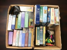 A collection of jigsaws, pair of headphones, pens, etc.