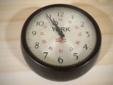 A circular Bakelite cased York railway station timepiece, diameter 27 cm.