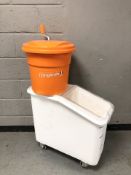 A Cambro plastic bin on castors and a mixing bucket