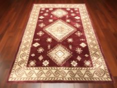 A machine made rug of Persian design,