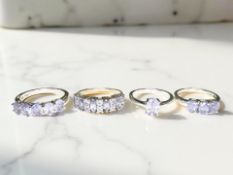 Four silver tanzanite dress rings.