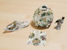 A Meissen encrusted porcelain scent bottle in the form of a cushion, a Bavarian porcelain slipper,