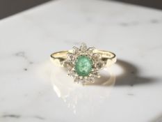A 9ct gold emerald dress ring, size L CONDITION REPORT: 1.