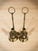 A pair of Dutch style brass hanging chamber candlesticks, height 25 cm.