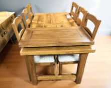 A modern solid oak extending dining table with leaf,