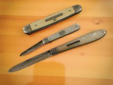 Two silver and mother of pearl fruit knives, and a further steel bladed example.