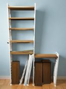 An enamelled metal and teak ladderax style wall shelf with adjustable shelves