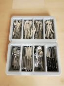 Two plastic cutlery trays containing a large quantity of stainless steel flatware