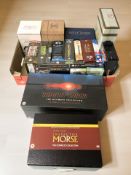 A collection of DVD box sets.