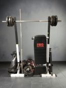 Exercise equipment including a squat rack, two bar bells, exercise bench,