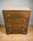 A Lebus oak four drawer chest,