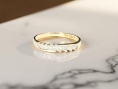 A 9ct gold diamond crossover ring, size M CONDITION REPORT: 1.