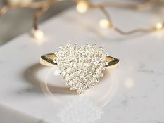 A 9ct gold diamond heart-shaped cluster ring, size K CONDITION REPORT: 2.