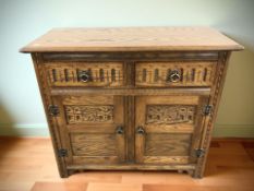 A carved oak Jaycee sideboard,