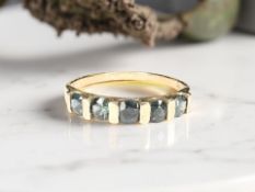 A 9ct gold Australian blue sapphire half-eternity ring,