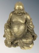 A gilt composition figure of Buddha, height 29 cm.