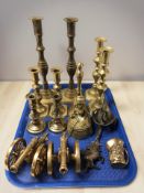 A group of brass candlesticks, miniature cannons, bell, etc.