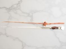 An antique-style Toledo sword in leather scabbard with leather and brass hilt,