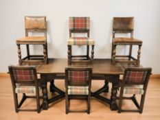 An oak pull out extending refectory dining table,