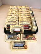 A collection of Lledo Days Gone boxed die cast delivery vans, buses, etc.