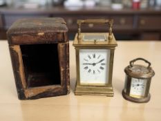 A brass striking and repeating carriage clock, height 16cm including handle,