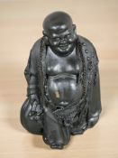 An oriental painted ceramic figure of Buddha, height 24 cm.