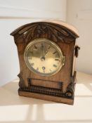 An early 20th century rosewood mantel clock, height 24 cm.