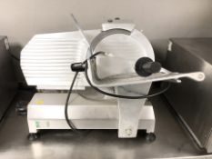 A stainless steel commercial meat slicer CONDITION REPORT: Removed from local