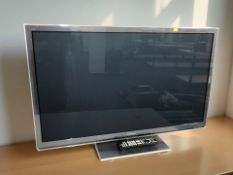 A Panasonic Vierra 32 inch LCD TV with lead and remote