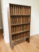An early 20th century pine filing bookcase containing 44 compartments,