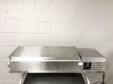 A stainless steel commercial counter top refrigeration unit